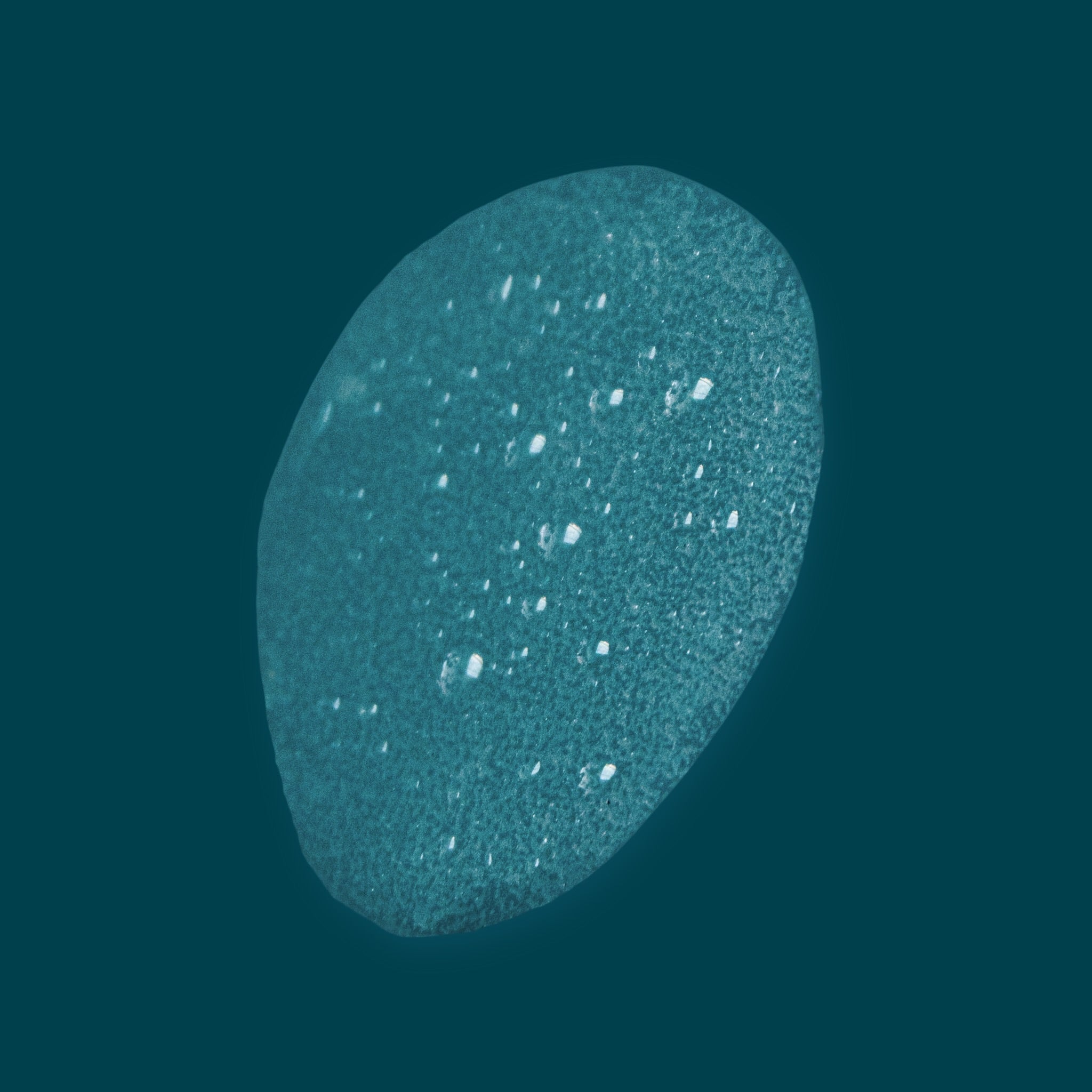 Lightweight liquid texture of Joyful Naturals rose water toner on teal background.